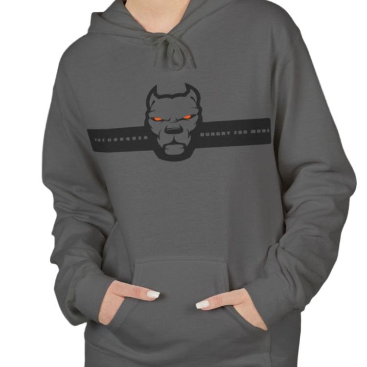 woman wearing sharcoal sporty hoodie for fitness and bodybuilding training by the brand Fitbull, branded with a logo and a motivating motif front view