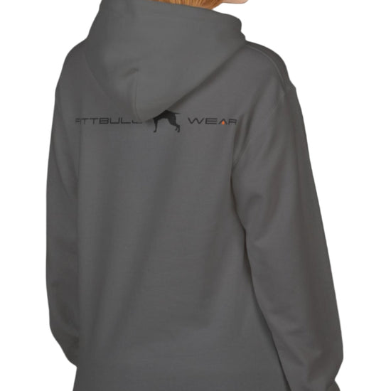 woman wearing grey sporty hoodie for fitness and bodybuilding training by the brand Fitbull, branded with a logo and a motivating motif side view