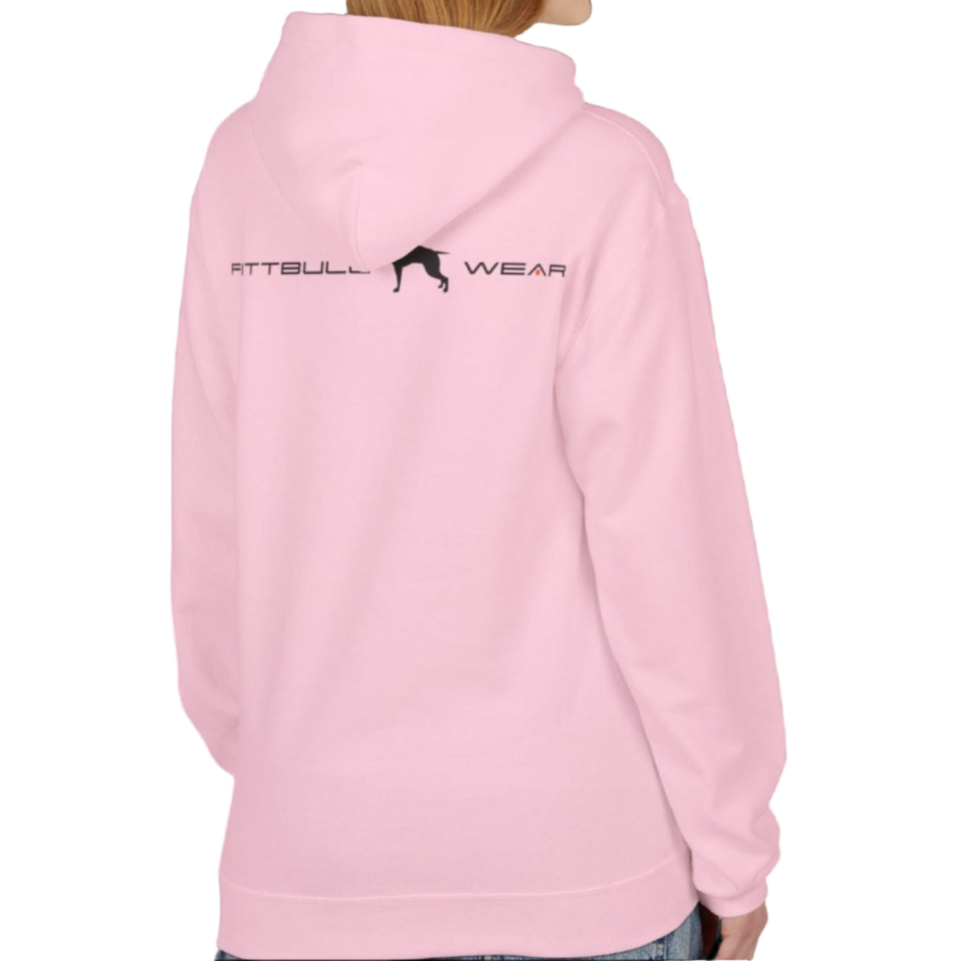 A woman wear sports pink hoodet, fitness sweatshirt Fitbull, with motivation desighn Unleash The Beast, back view.
