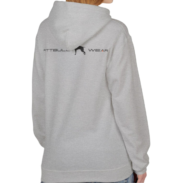 A woman wear sports silver grey hoodet, fitness sweatshirt Fitbull, with motivation desighn Unleash The Beast, back view.
