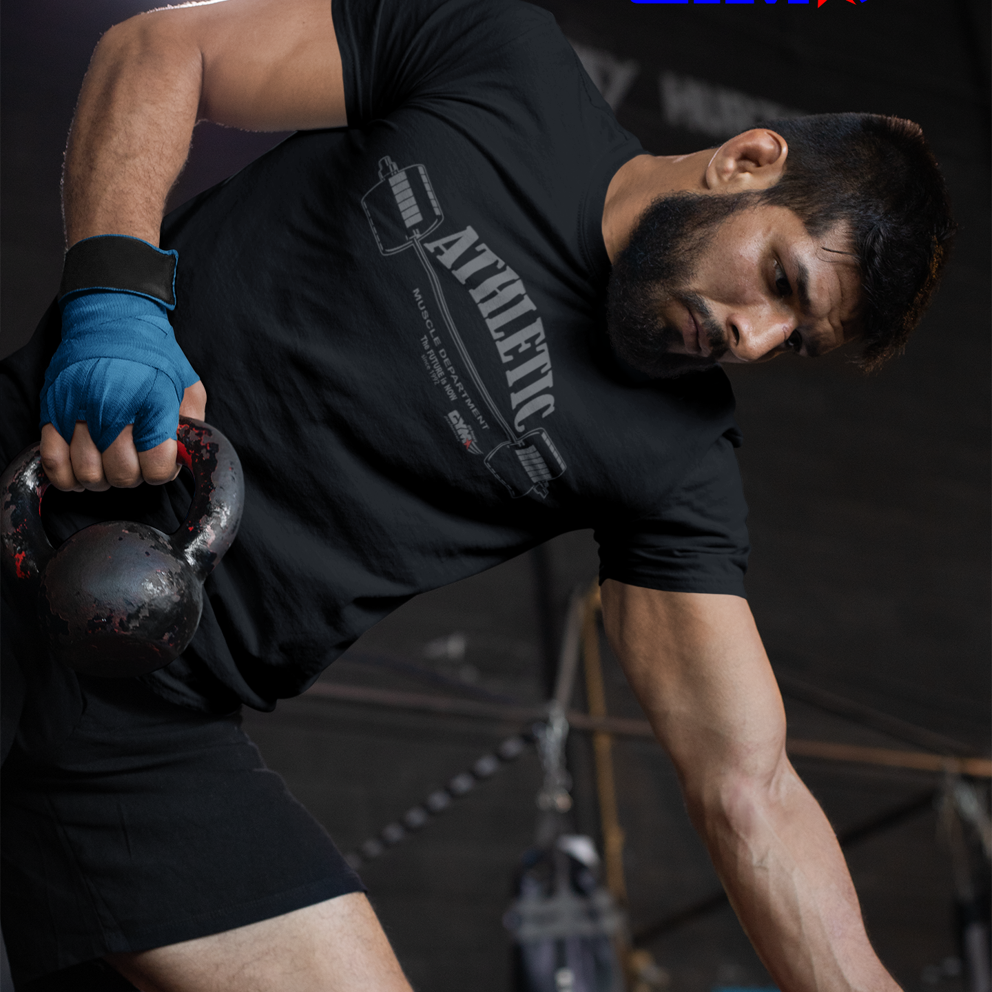 Person lifting a kettlebell in a gym setting with 'GYMSTAR' branding.