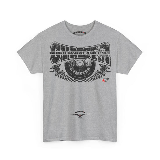 A heather gray short-sleeve t-shirt with a large black graphic print on the front featuring a vinyl record, wings, and the text 'Gymnster Blood Sweat and Iron'. A small red star accent is visible on the right side of the graphic, and a smaller Gymnster logo is printed near the lower hem.