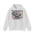 A light heather gray pullover hoodie with a distressed American flag graphic on the chest, featuring a barbell and a skull with the text 'BORN TO PUMP' and 'PUMP TO LIVE' by Pump to Live.