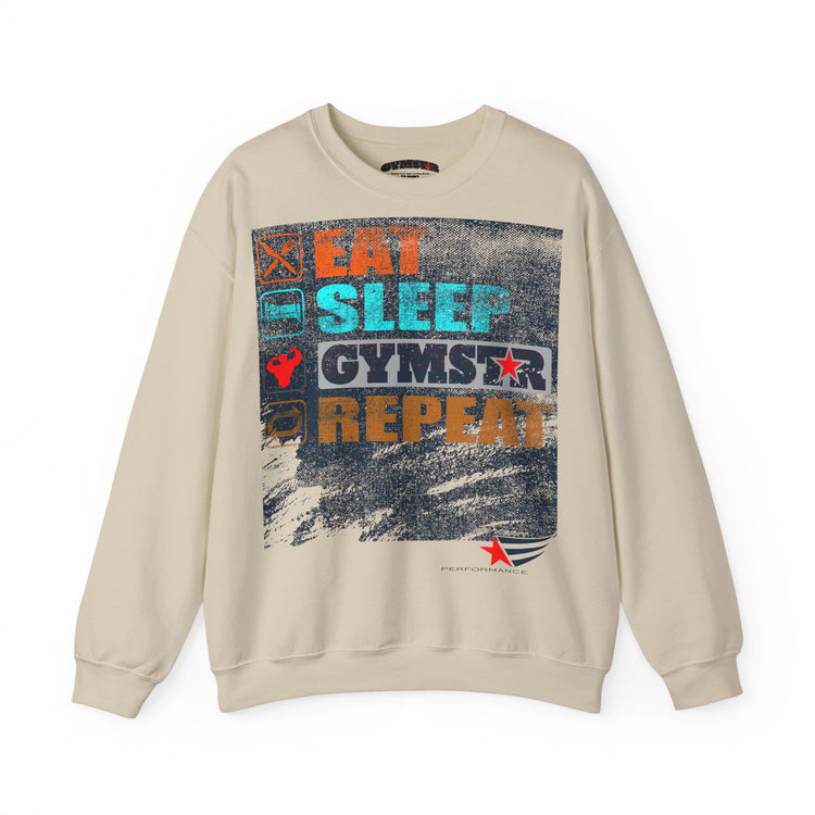 A beige crewneck sweatshirt featuring a large graphic print on the front with the text 'EAT SLEEP GYMSTAR REPEAT' in orange, blue, and white, set against a plain white background.