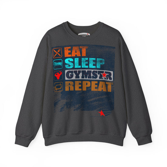 A dark gray crewneck sweatshirt featuring a colorful graphic print on the front with the text 'EAT SLEEP GYMSTAR REPEAT' and small fitness-themed icons, shown against a plain white background.