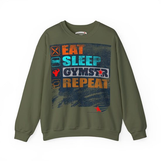 An olive green crewneck sweatshirt with a distressed graphic on the chest that reads 'EAT SLEEP GYMSTAR REPEAT' in orange, blue, and white text, accompanied by small fitness icons.