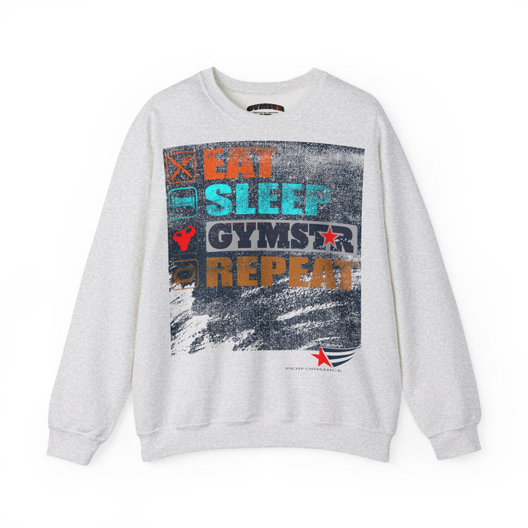 A light gray crewneck sweatshirt featuring a large rectangular graphic print on the front with the words 'EAT SLEEP GYMSTAR REPEAT' in various colors over a distressed gray background.