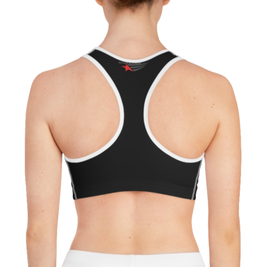 A women's solid black athletic sports bra Gymstar, shown from the back. It features white trim and a racerback style. The brand's logo is visible on the upper back, just below the neckline.