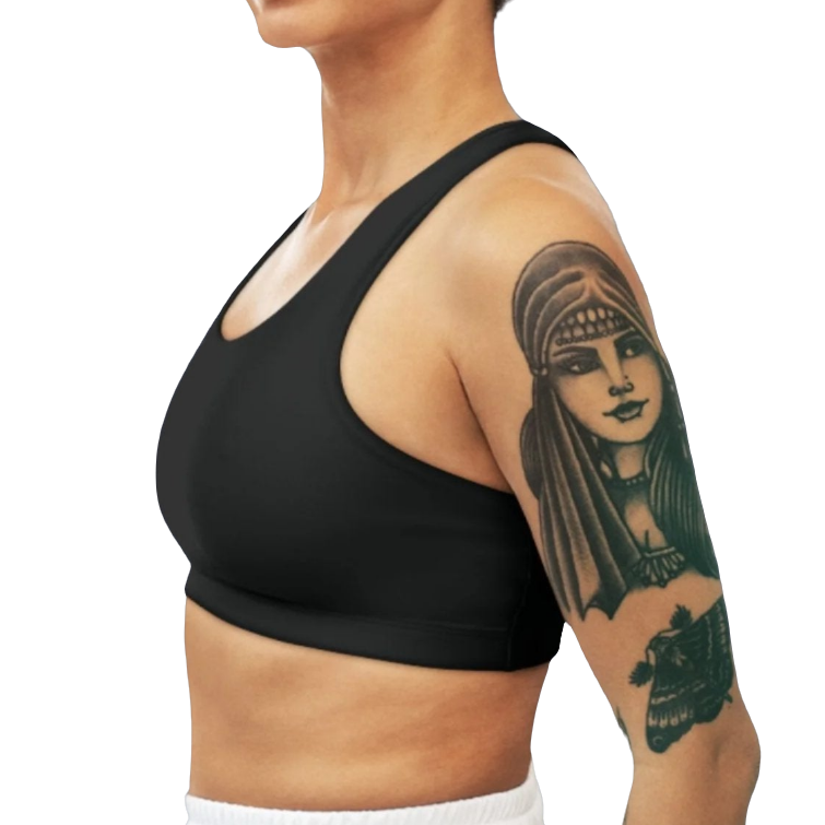 A woman wearing Black  sports, fitness bra from the Gimstar brand, with white seams and a small logo on the left side. Left side view.
