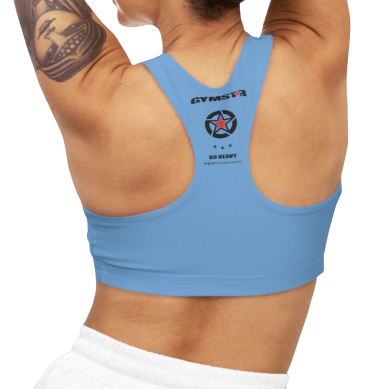 A woman wearing Carolina Blue,  sports, fitness bra from the Gimstar brand, with  a small logo on the left side. Rear view.