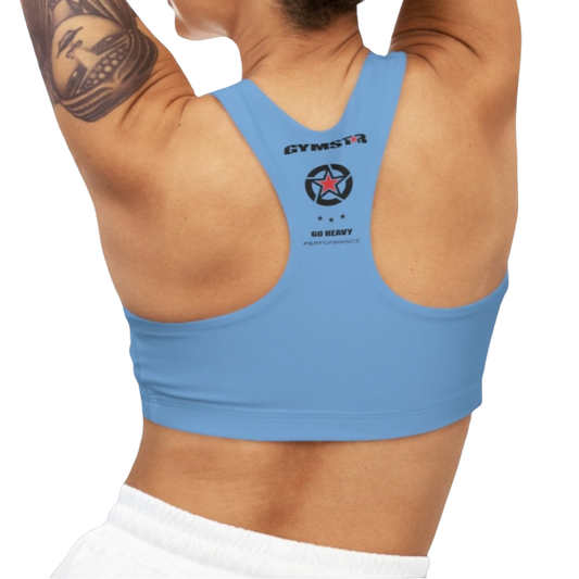 A woman wearing Carolina Blue,  sports, fitness bra from the Gimstar brand, with  a small logo on the left side. Rear view.