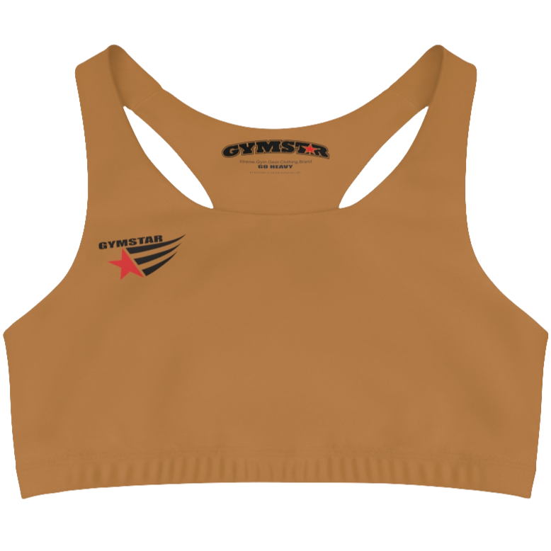 A women's solid brown athletic sports bra Gymstar. It has a scoop neckline and a racerback style. A logo with a red star and three black stripes is on the left chest, with the brand name "GYMSTAR" in black text above it. The main brand tag with "GYMSTAR" is visible on the inner back neckline.