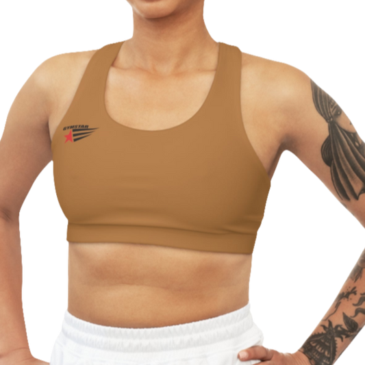 A women's solid brown athletic sports bra. It has a scoop neckline and a racerback fitness style. A small logo featuring a star and three red and blue stripes is on the left side of the chest, with the brand name "GYMSTAR" above it.