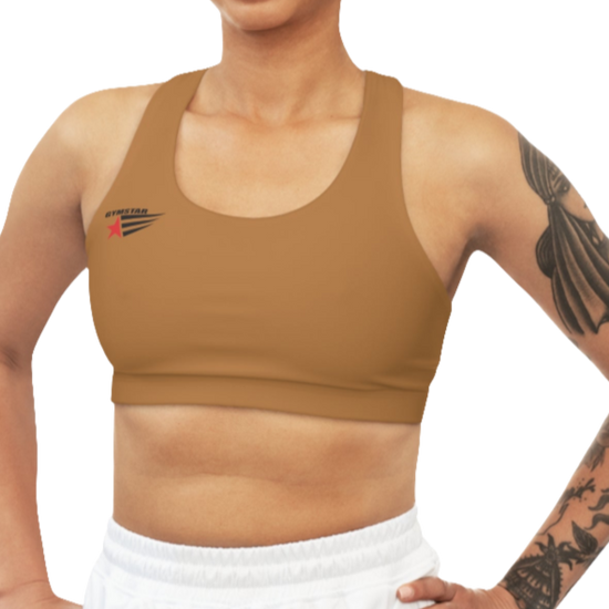 A women's solid brown athletic sports bra. It has a scoop neckline and a racerback fitness style. A small logo featuring a star and three red and blue stripes is on the left side of the chest, with the brand name "GYMSTAR" above it.
