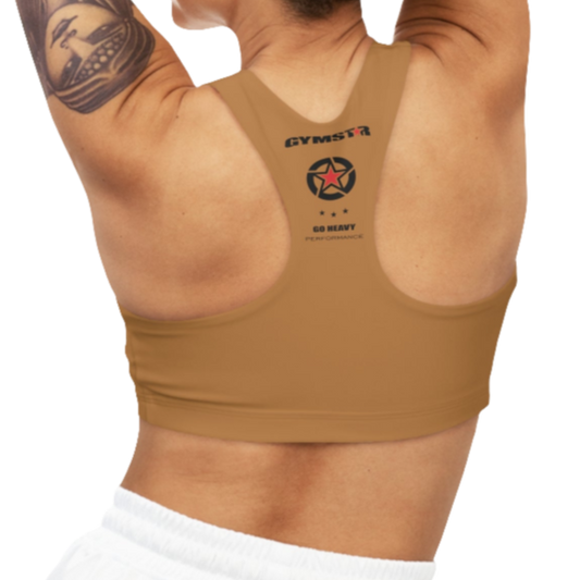 
A women's solid brown athletic sports bra, shown from the back. It has a racerback style. The brand's logo, a red star within a circle of smaller stars, is printed on the upper back, along with the "GYMSTAR" brand name and the tagline "GO HEAVY PERFORMANCE."