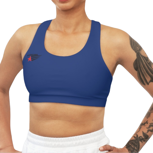 A woman wearing Blue,  sports, fitness bra from the Gimstar brand, with  a small logo on the left side. Front view.