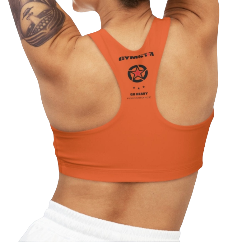 A woman wearing Orange,  sports, fitness bra from the Gimstar brand, with  a small logo on the left side. Rear view.