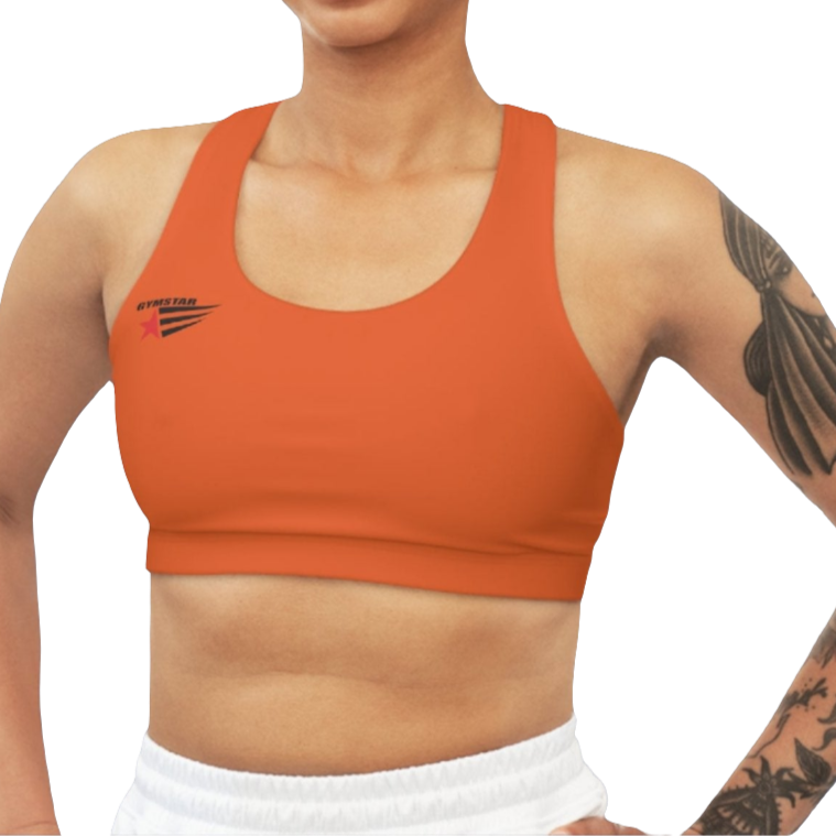 A woman wearing Orange,  sports, fitness bra from the Gimstar brand, with  a small logo on the left side. Front view.