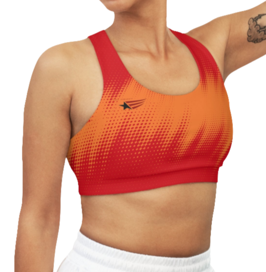 A women's athletic sports bra Gymstar. It is primarily red with a orange, dotted, gradient pattern that radiates from the sides and bottom. The straps are solid red. A small logo featuring a star and three red and blue stripes is on the left side of the chest. Right side view.