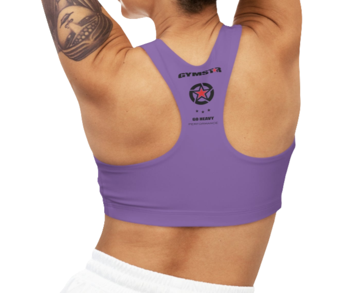 A person wearing a purple Gymstar sports bra from behind, with the brand's logo visible on the back.