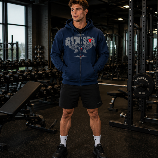 Man wearing a blue hoodie with 'Gymstar' branding in a gym setting