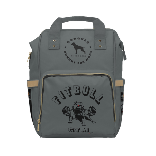 A gray FITBULL gym backpack with a logo that includes a stylized bull and the text 'FITBULL GYM', featuring multiple pockets and a padded shoulder strap design.