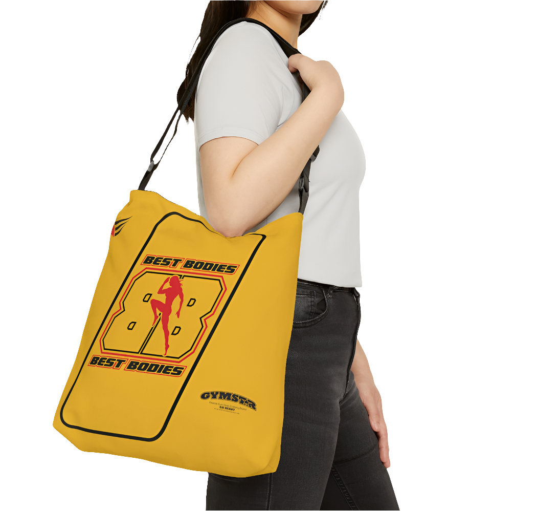A person carrying a yellow tote bag with 'GYMSTAR' branding and a graphic Best Bodies design that includes a silhouette of a person lifting weights.