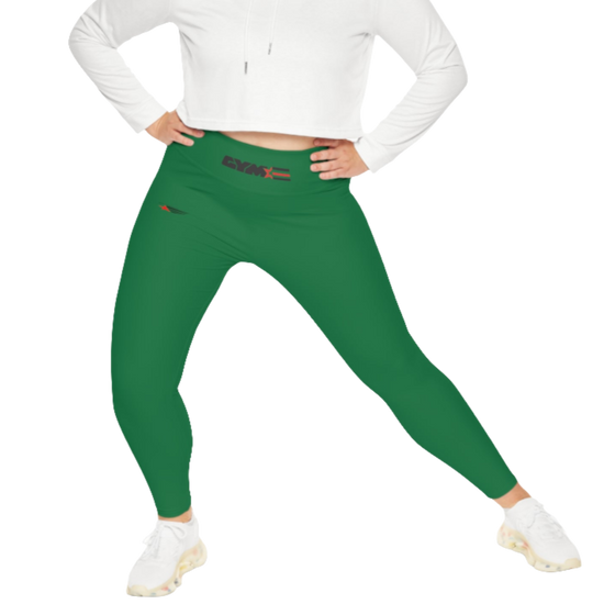 A woman wearing green high-waisted fitness leggings Gymstar with a logo on the waistband, paired with white sneakers. Action front view.