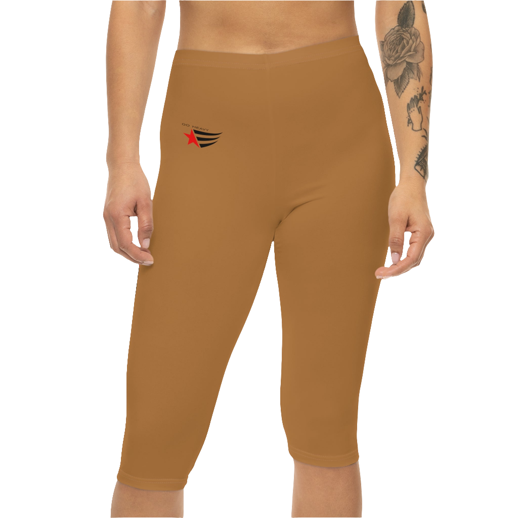 A woman wearing pair of brown Gymstar fitness leggings with a small logo on the left thigh area, designed for women. Front, close up view.