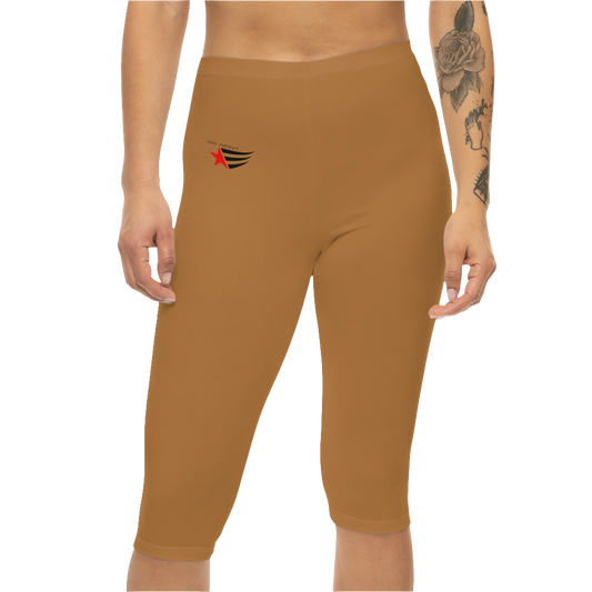 A woman wearing pair of brown Gymstar fitness leggings with a small logo on the left thigh area, designed for women. Front, close up view.