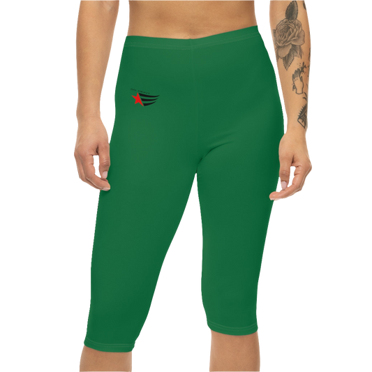 A woman wearing pair of green Gymstar brand fitness leggings featuring a mid-rise waist and a capri style design with a logo. Front view.