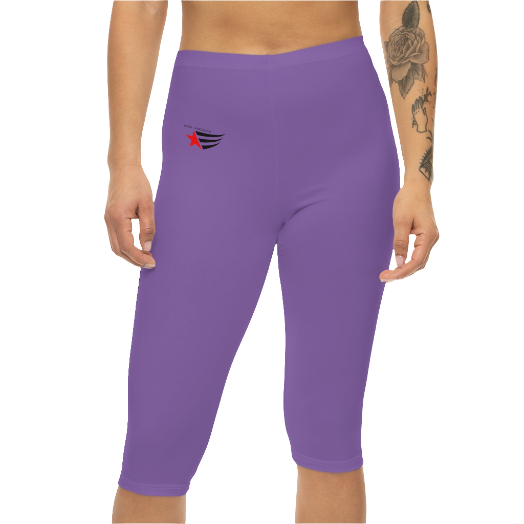 A woman wearing pair of purple fitness Gymstar leggings with a small logo on the upper left thigh area, designed for women's workouts. Front close up view.