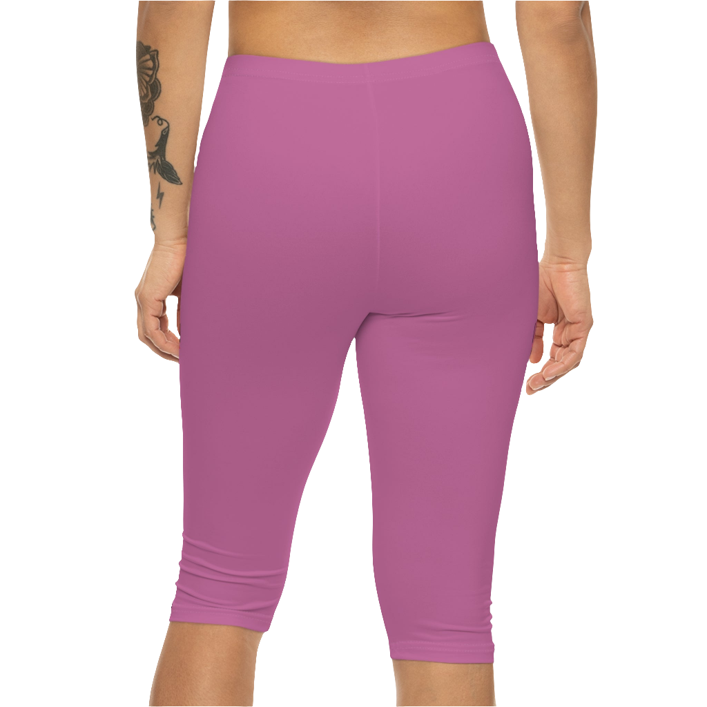 A woman wearing a pair of red-purple Gymstar fitness leggings with a small logo on the left thigh area, designed for women training and joga. Rear close up view.