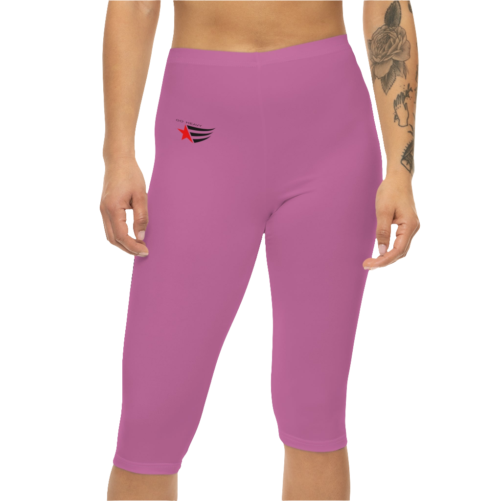 A woman wearing a pair of red-purple Gymstar fitness leggings with a small logo on the left thigh area, designed for women training and joga. Front close up view.