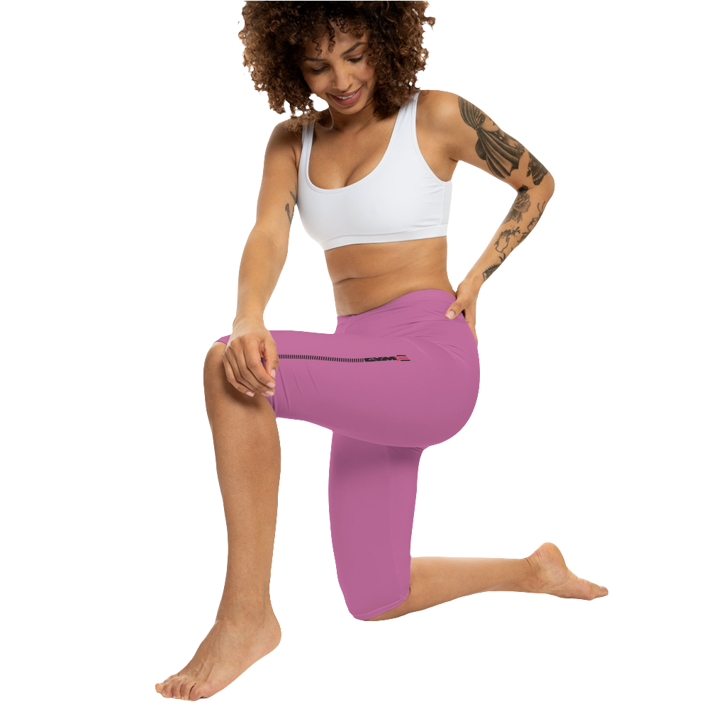 A woman wearing a pair of red-purple Gymstar fitness leggings with a small logo on the left thigh area, designed for women training and joga. Action front  view.