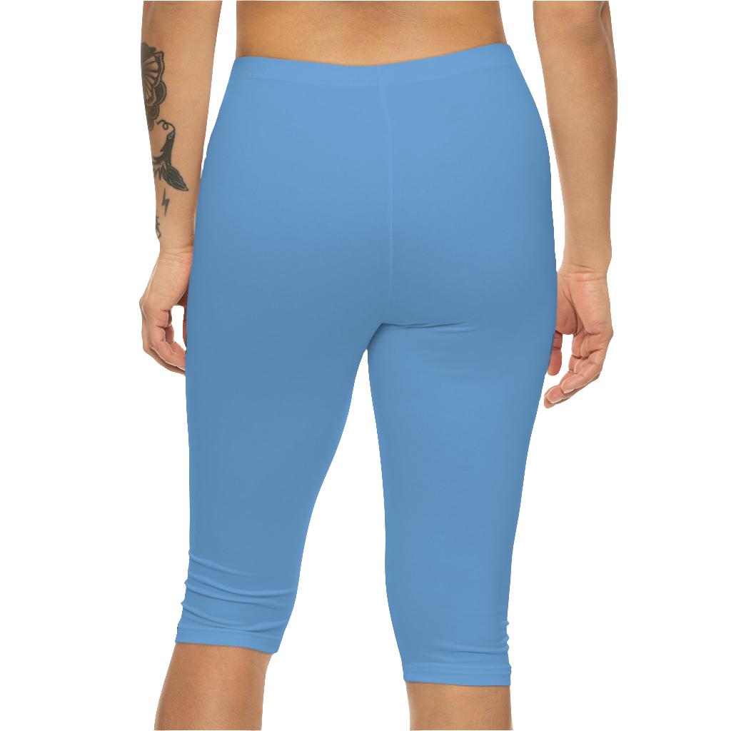 A woman wearing pair of blue fitness Gymstar leggings with a small logo on the upper left thigh area, designed for women's workouts. Rear close up view.