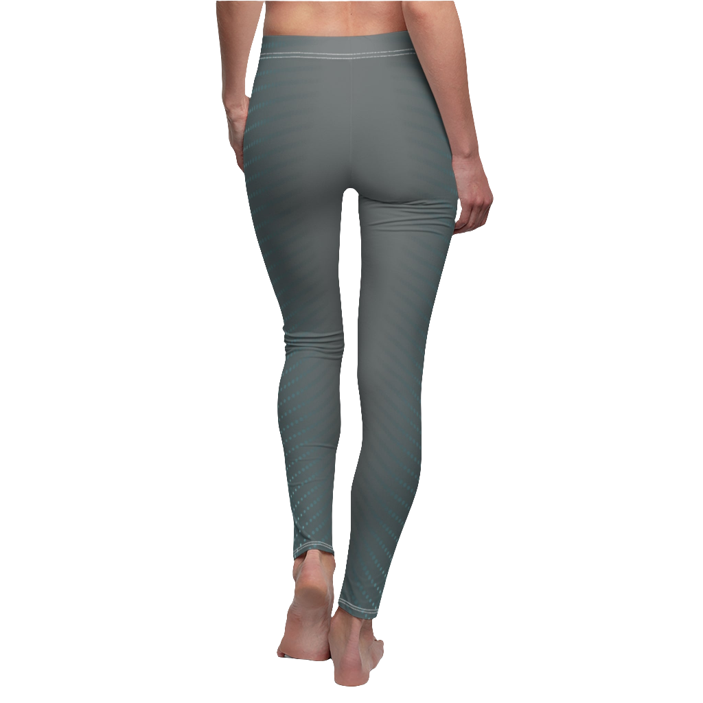 A woman wearings pair of gray fitness leggings with a geometric pattern, featuring a high waist and capri cut design. Rear close up view.