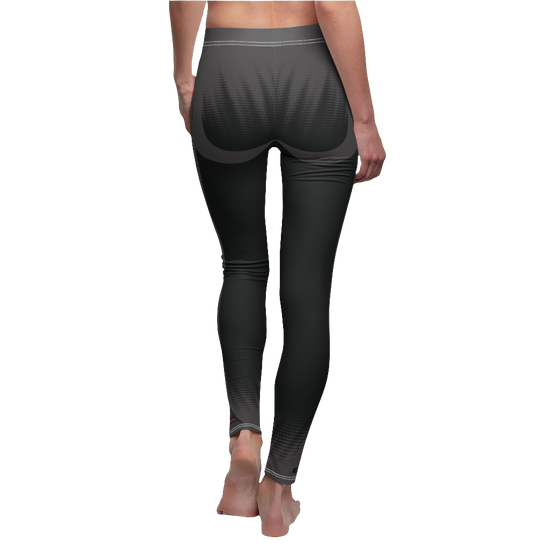 A female fitness model wearing pair of black Gymstar women's fitness leggings with capri cut, featuring white seam stitching and a mid-rise waist and art design.  Rear close up view.   
