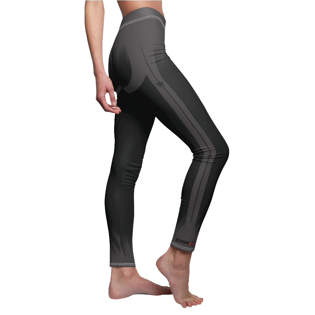 A female fitness model wearing pair of black Gymstar women's fitness leggings with capri cut, featuring white seam stitching and a mid-rise waist and art design.  Right side close up view.    
