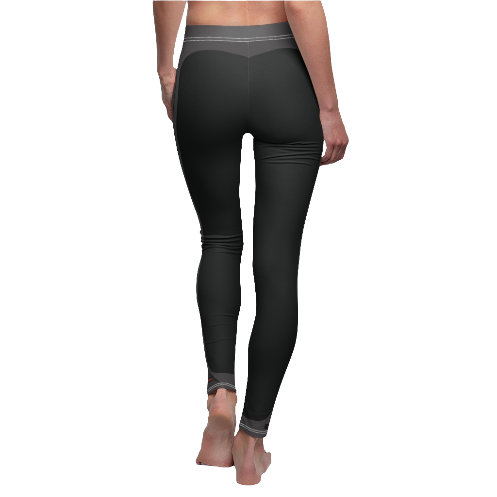 A female fitness model wearing pair of black Gymstar women's fitness leggings with capri cut, featuring white seam stitching and a mid-rise waist and gym art design.  Rear close up view.   