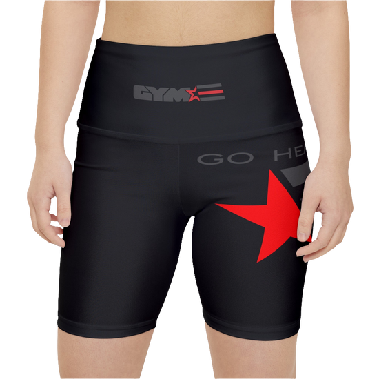 A woman wearing pair of black Gymstar fitness leggings with a mid-rise waist and white seam stitching. The leggings are designed for functionality and aesthetics, suitable for various workouts including yoga and crossfit. Front close up view.