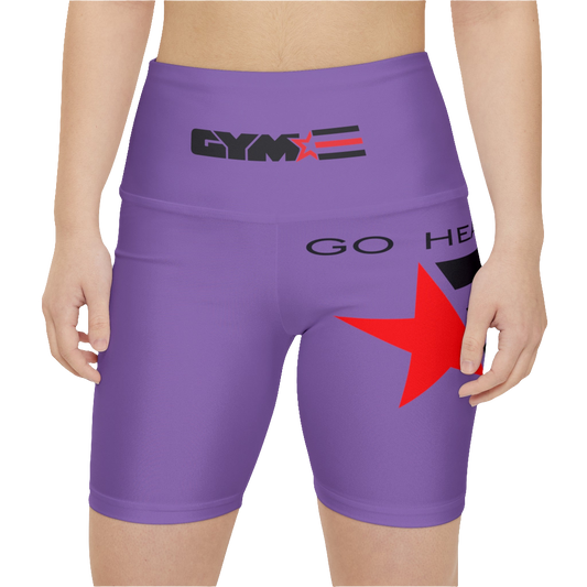 A woman wearings pair of purple Gymstar women's workout leggings with 'GYMSTAR' and 'GO HEAVY' text, along with a star graphic, on a person mid-section view. front close up view.