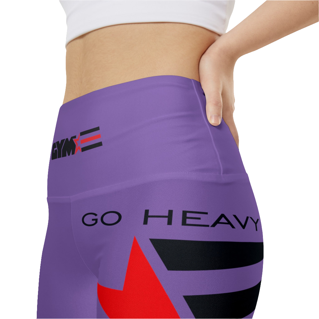 A woman wearings pair of purple Gymstar women's workout leggings with 'GYMSTAR' and 'GO HEAVY' text, along with a star graphic, on a person mid-section view. front extemelly close up view.
