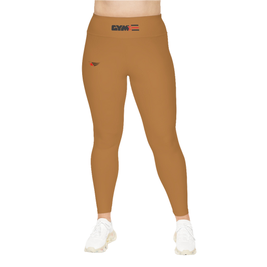 A woman wearing pair of brown high-waisted Gymstar fitness leggings with a logo on the upper left thigh, paired with white sneakers. Front view.