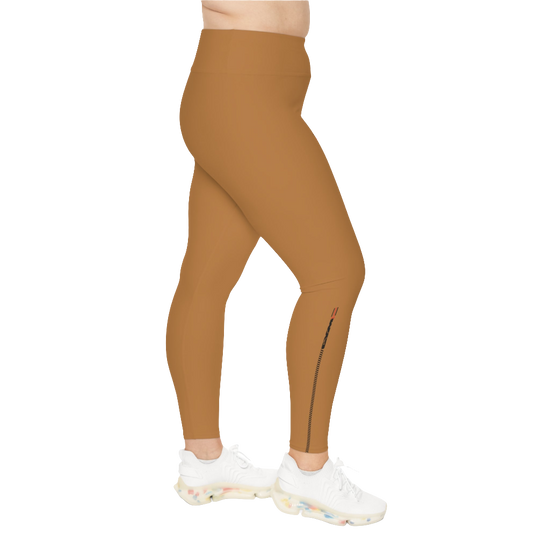 A woman wearing pair of brown high-waisted Gymstar fitness leggings with a logo on the upper left thigh, paired with white sneakers. Left side view.