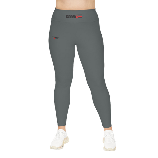 A woman wearing pair of grey high-waisted Gymstar fitness leggings with a logo on the upper left thigh, paired with white sneakers. Front view.
