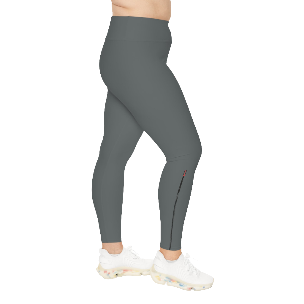 A woman wearing pair of grey high-waisted Gymstar fitness leggings with a logo on the upper left thigh, paired with white sneakers. Left side view.