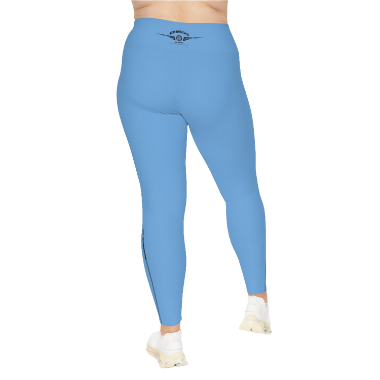 A woman wearing blue high-waisted fitness leggings with a Gymstar logo on the waistband, standing upright with a neutral expression. Rear view.