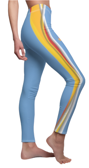 A woman wearing pair of blue Gymstar fitness yoga women's cut and sew casual leggings with a visible yellow and red stripe on the side. Left side view.