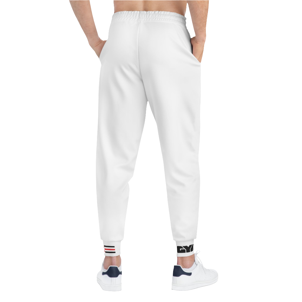 A person standing backways, wearing silver white joggers Gymstar with a logoand white sneakers. The joggers have a ribbed bottom and waistband cuffs, and feature two side pockets.